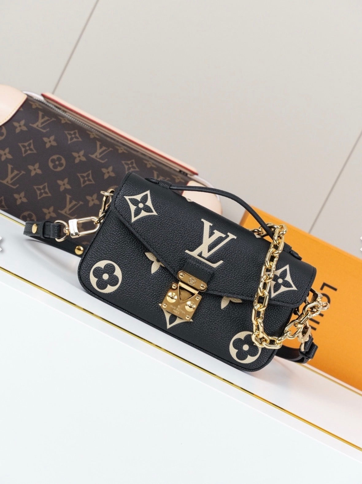 L V blk/white chain bag