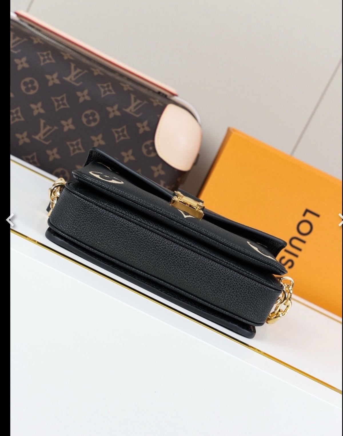 L V blk/white chain bag