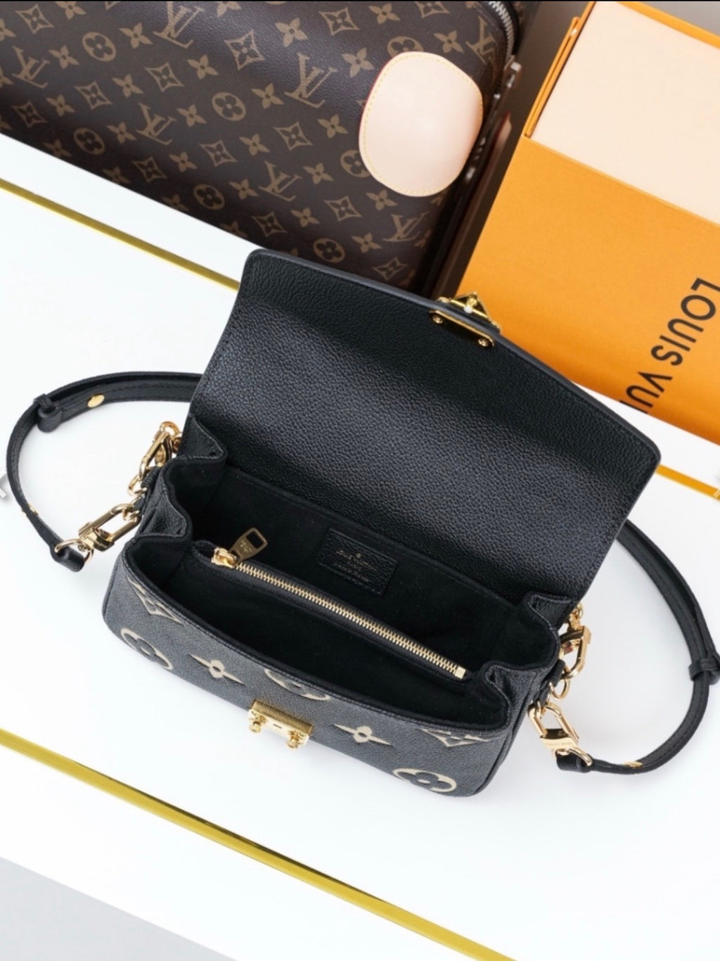 L V blk/white chain bag