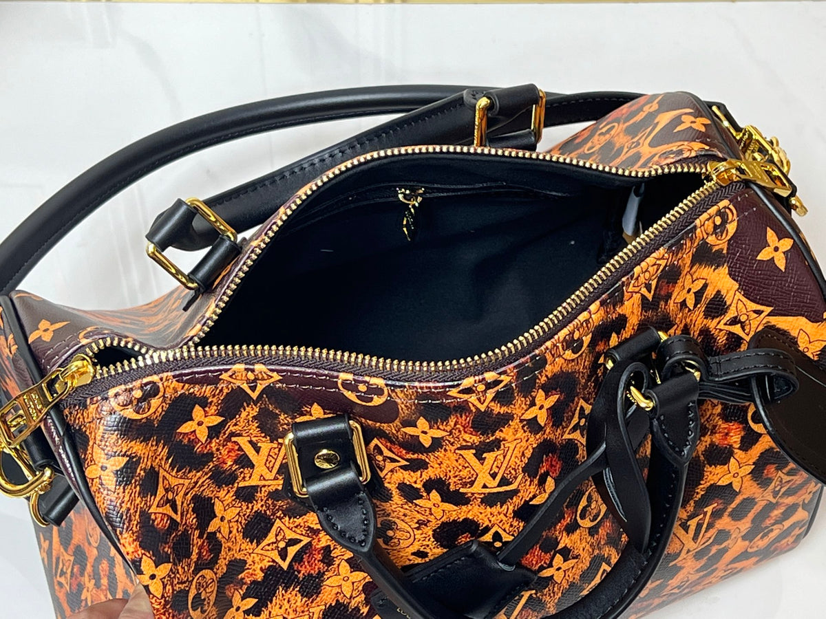 L V tortoise bag