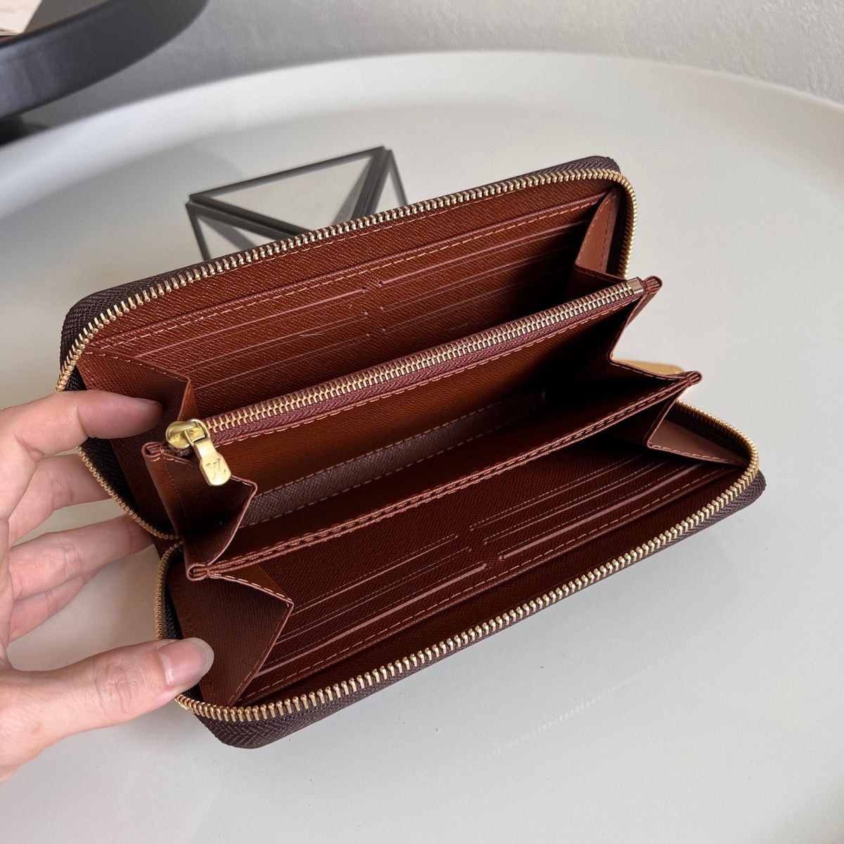 L V Brown logo zipper wallet