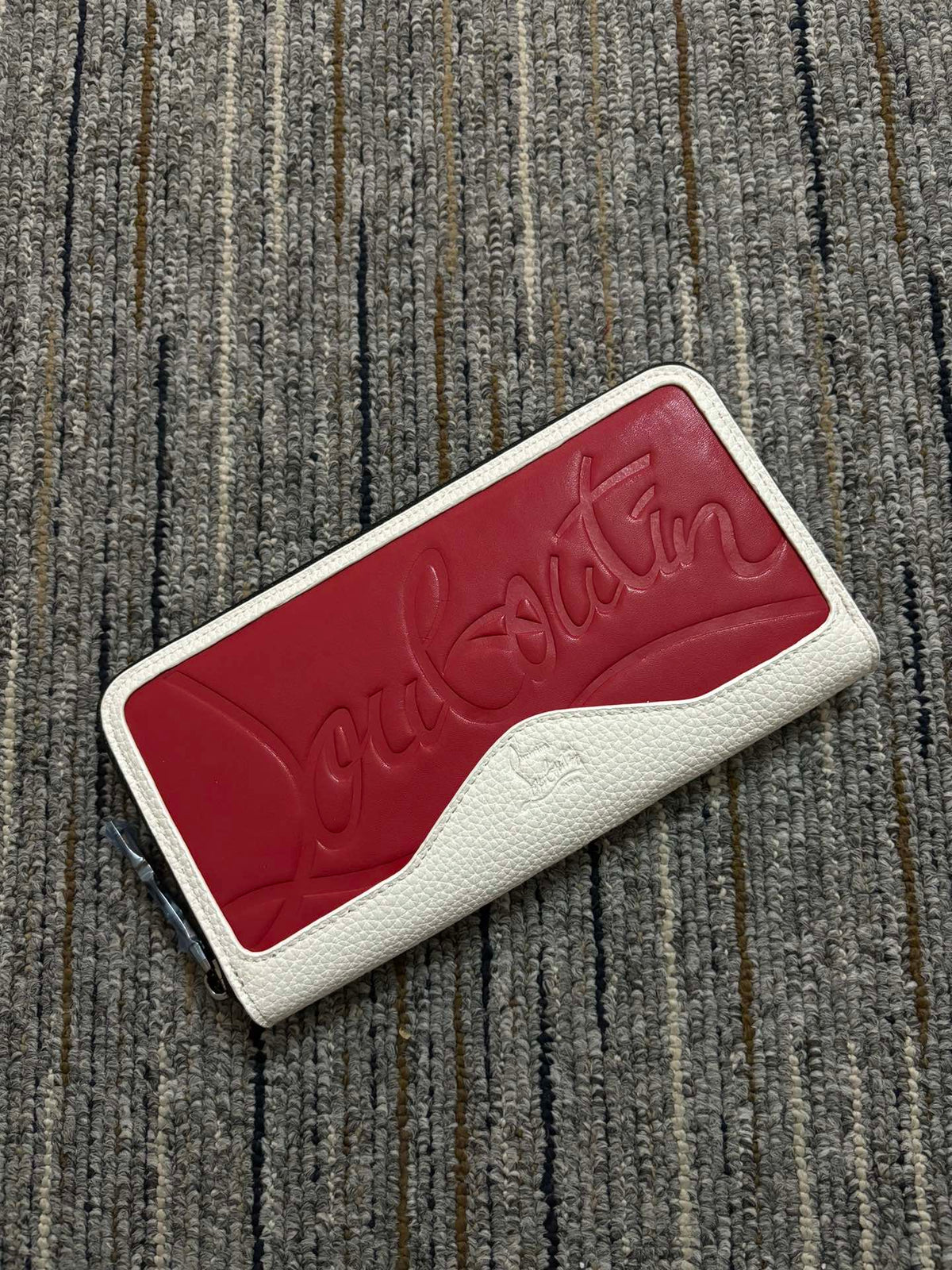 Red bottom embossed wallet