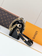 L V blk/white chain bag